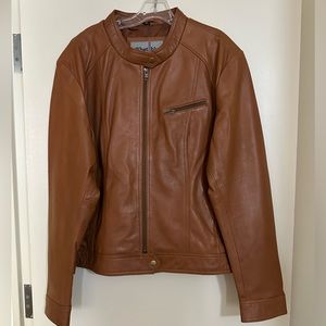 Brown leather jacket. 5x but fits for like a 3-4X. 100% leather